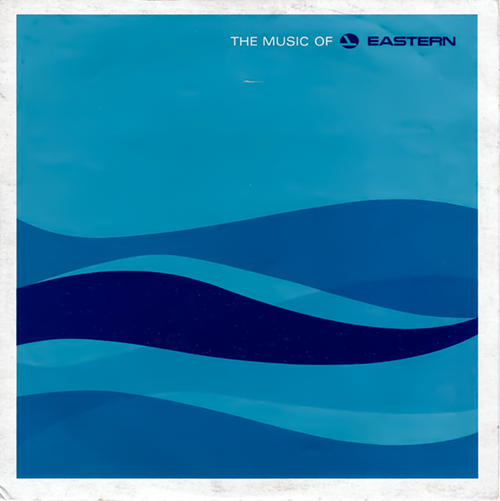 The image shows the record sleeve for the vinyl record from the previous image. The sleeve has a predominantly blue color scheme with abstract, wavy lines creating a stylized representation of waves or hills. These waves are in varying shades of blue, giving a sense of layering and depth. In the top right corner, the text "THE MUSIC OF" is followed by the "EASTERN" logo, which is the same as the one on the record label, indicating that the music is associated with the Eastern brand. The sleeve's design is minimalist, using the contrast of blue tones and simple shapes to create a modern and sleek look.