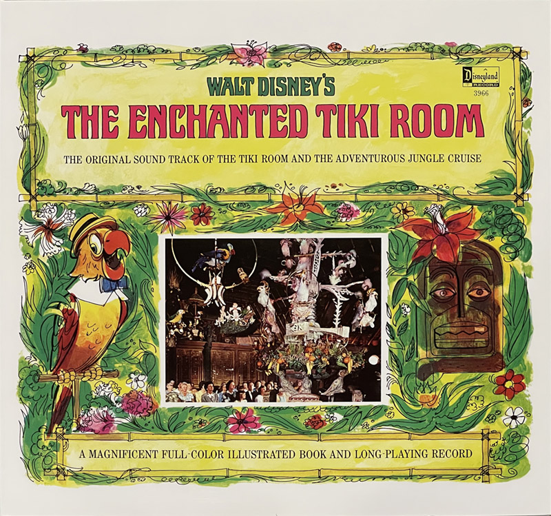 The image is of a record sleeve titled "Walt Disney's The Enchanted Tiki Room." The cover features a vibrant, tropical design with a green border adorned with colorful flowers and leaves. On the left side, there is an illustration of a parrot perched on a branch, wearing a hat and bow tie. On the right side, there is an illustration of a traditional tiki mask surrounded by flowers and leaves. In the center, there is a rectangular photograph of the Tiki Room attraction, showing animatronic birds and flowers entertaining an audience. The text at the top reads "Walt Disney's THE ENCHANTED TIKI ROOM" in bold red and yellow letters, with a smaller subtitle below: "THE ORIGINAL SOUND TRACK OF THE TIKI ROOM AND THE ADVENTUROUS JUNGLE CRUISE." At the bottom, it states: "A MAGNIFICENT FULL-COLOR ILLUSTRATED BOOK AND LONG-PLAYING RECORD." The Disneyland Records logo is present in the top right corner.