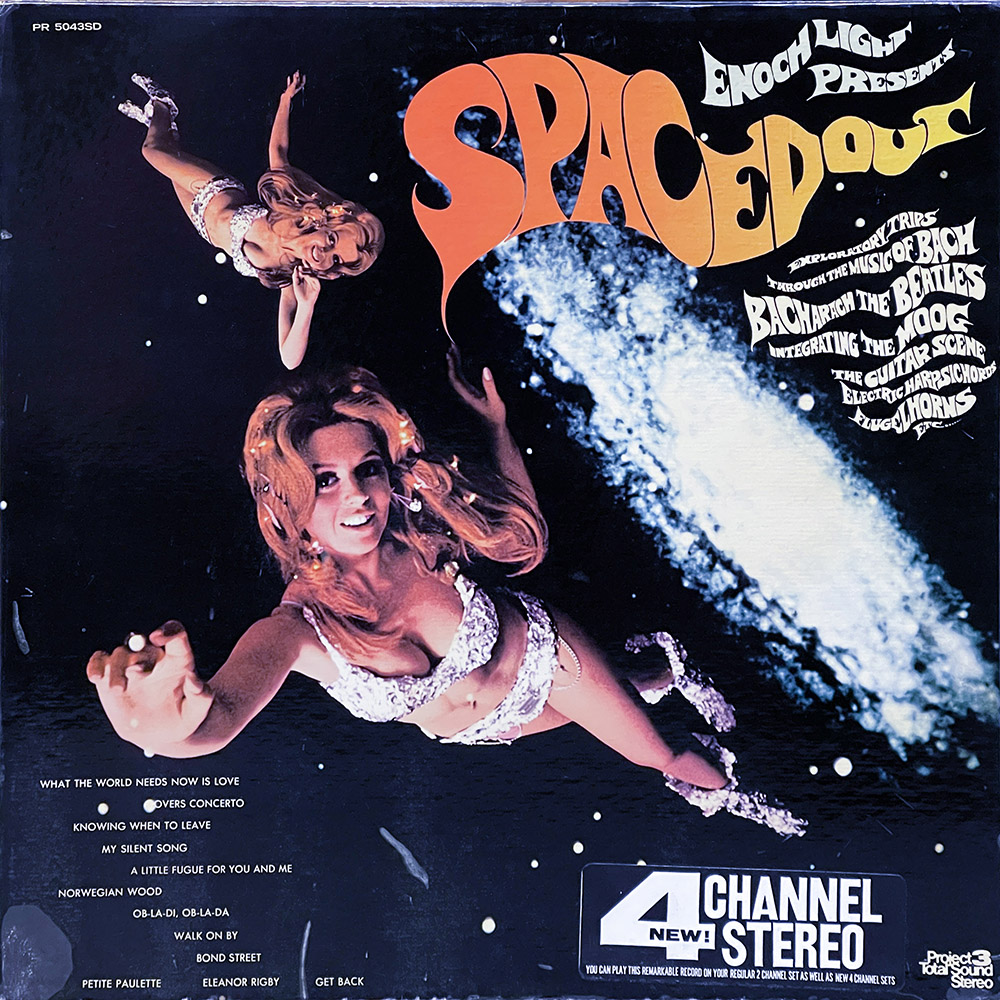 This image is the album cover for "Spaced Out" by Enoch Light. It features a surreal cosmic theme with two women, portrayed in dynamic poses, floating in outer space. Both women are dressed in glittering, white and silver space-themed outfits, with dramatic makeup and voluminous, flowing hair, giving them an ethereal appearance. The background is a dark outer space with stars and a celestial body, enhancing the cosmic vibe. The album title "Spaced Out" is displayed in a large, orange, psychedelic font at the top, and the cover also lists some musical tracks and mentions that the album includes works by Bach, The Beatles, and Moog synthesizers, highlighted as an exploration through these musical styles. The record is advertised as a 4 channel stereo recording.