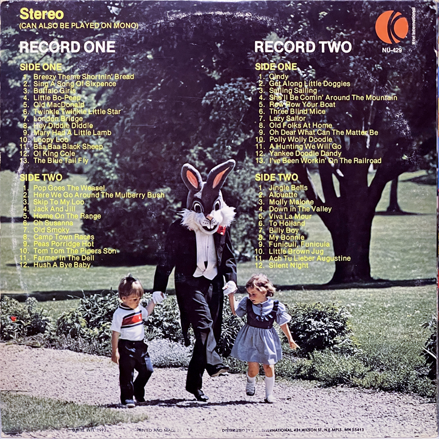 The back cover of the same album shows the same rabbit-costumed character walking hand-in-hand with two children along a park path. Above them, the track list is split into two sections: Record One and Record Two, with song titles listed for Side One and Side Two of each. Songs include classic children’s tunes like “Twinkle Twinkle Little Star,” “Yankee Doodle Dandy,” and “I’ve Been Workin’ On the Railroad.” The red K-tel logo and catalog number NU-429 are visible in the top right.