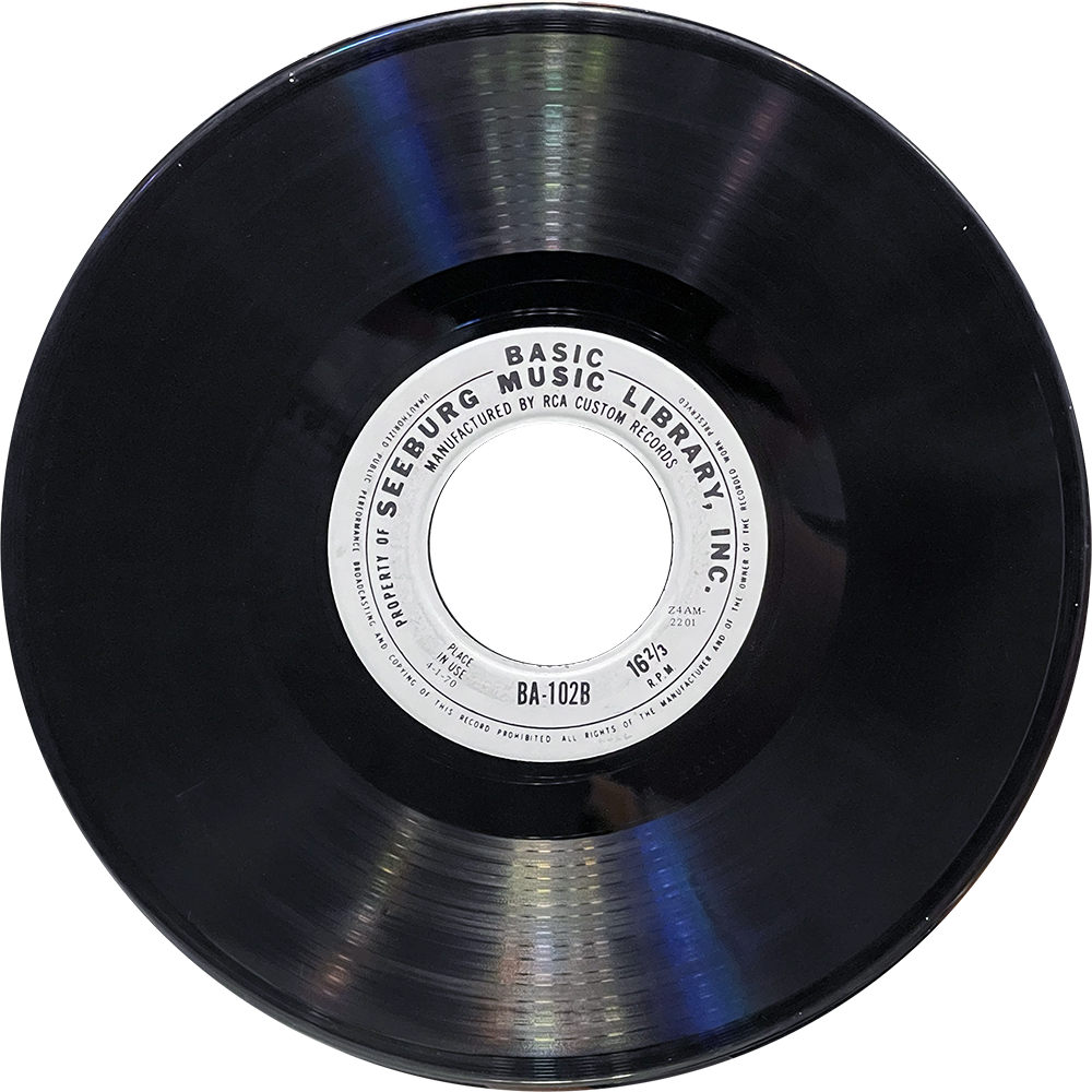A Seeburg Basic Music Library vinyl record, side B (BA-102B), with a large 2-inch center hole and label indicating 16⅔ RPM playback, manufactured by RCA Custom Records.