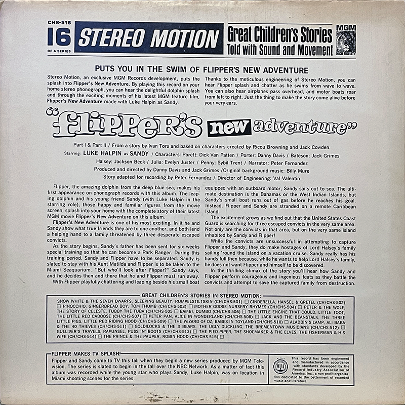 Back cover of the 1964 MGM Records LP Flipper’s New Adventure (catalog number CHS-516) from the Great Children’s Stories in Stereo Motion series. The layout is mostly text in black on a white background. At the top are the Stereo Motion and MGM High Fidelity logos, followed by a description promising “Flipper’s splash and chatter” recreated in stereo. Cast and production credits are listed, including Luke Halpin as Sandy, narration by Peter Fernandez, and music by Billy Mure. The center section summarizes the story, where Sandy and Flipper are stranded on a Caribbean island while convicts hide out. The bottom section advertises other children’s records in the series, alongside a short note about Flipper’s TV debut.