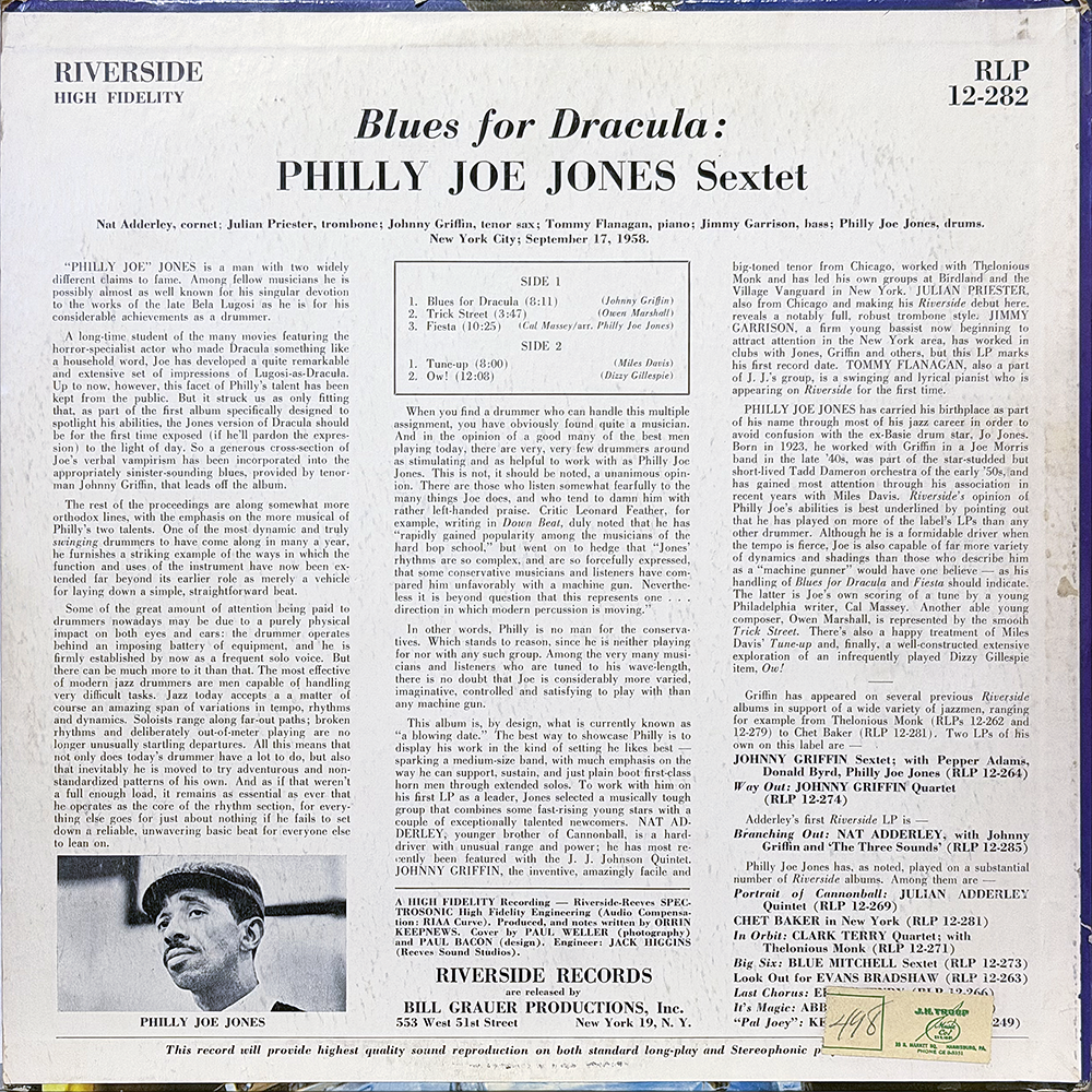 ack cover of Blues for Dracula (1958) by the Philly Joe Jones Sextet, released on Riverside Records. The layout is text-heavy, featuring liner notes about drummer Philly Joe Jones, the contributing musicians (Nat Adderley, Julian Priester, Johnny Griffin, Tommy Flanagan, and Jimmy Garrison), and details about the recording session at Reeves Sound Studios, New York City, on September 17, 1958. The track listing appears in the center, with Side 1 including “Blues for Dracula,” “Trick Street,” and “Fiesta,” and Side 2 including “Tune-Up” and “Ow!” A small black-and-white photo of Philly Joe Jones appears at the bottom left corner. The Riverside Records logo and production credits are at the bottom.
